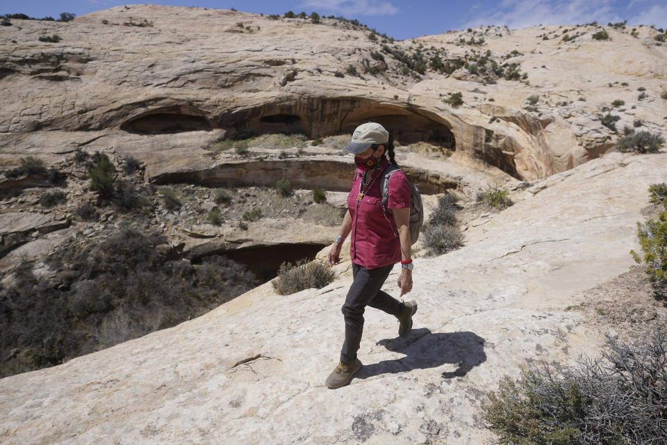 U.S. Interior Secretary Deb Haaland tours near ancient dwellings along the Butler Wash trail during a visit to Bears Ears National Monument Thursday, April 8, 2021, near Blanding, Utah. (AP Photo/Rick Bowmer, Pool)