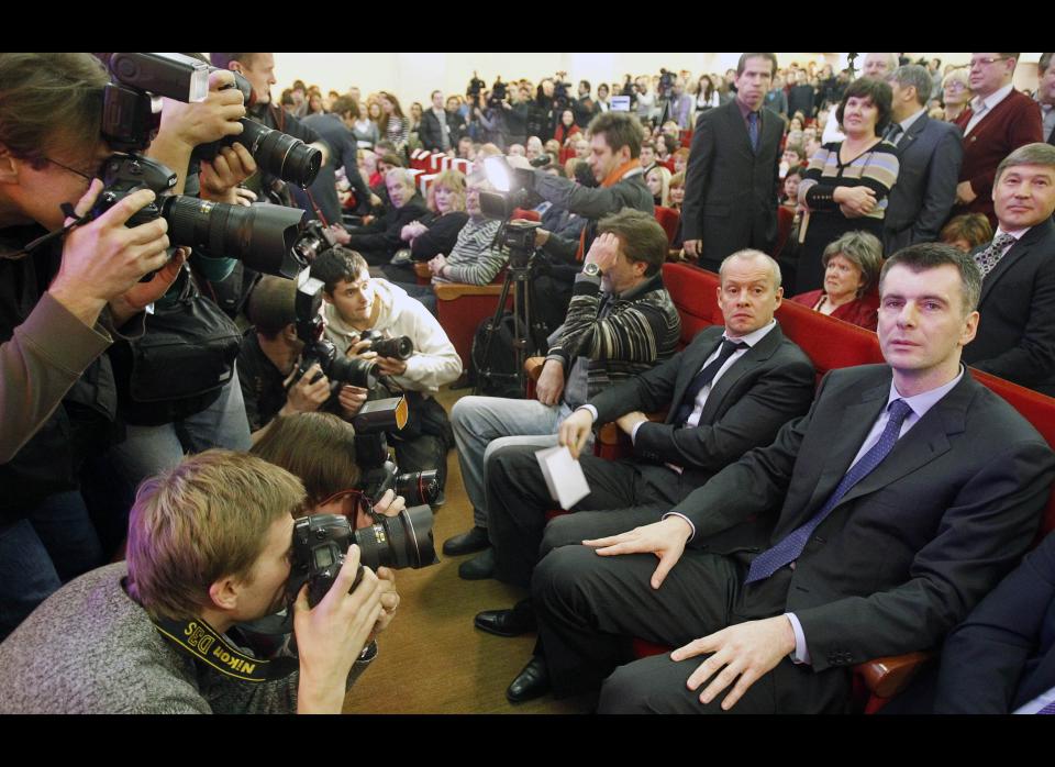 Mikhail Prokhorov, Russian billionaire and New Jersey Nets owner, right, attends a meeting with supporters who nominated him for the Presidential election in Moscow, Russia, Thursday, Dec. 15, 2011. Prokhorov said his first move if elected will be to pardon jailed tycoon Mikhail Khodorkovsky. (AP Photo/Misha Japaridze)