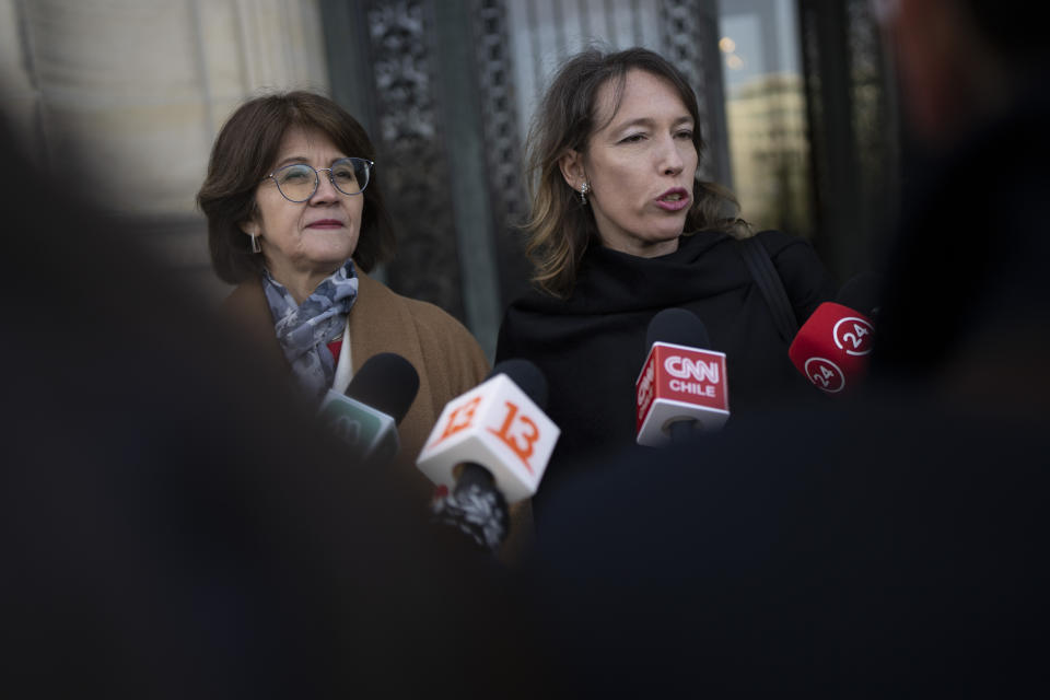 Ximean Fuentes, Chile's vice-minister for foreign affairs, left, and lawyer Carolina Valdivia Torres answer questions outside the World Court in The Hague, Netherlands, Thursday, Dec. 1, 2022, where the UN's top court rules on a dispute about a river that crosses Chile's and Bolivia's border, in a case seen as important jurisprudence at a time when fresh water is becoming an increasingly coveted world resource. (AP Photo/Peter Dejong)