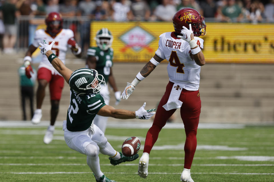 CORRECTS DATE TO SEPT. 16 - Iowa State defensive back Jeremiah Cooper, right, breaks up a pass intended for Ohio wide receiver Sam Wiglusz during an NCAA college football game Saturday, Sept. 16, 2023 in Athens, Ohio. Cooper was called for pass interreference. (AP Photo/Paul Vernon)