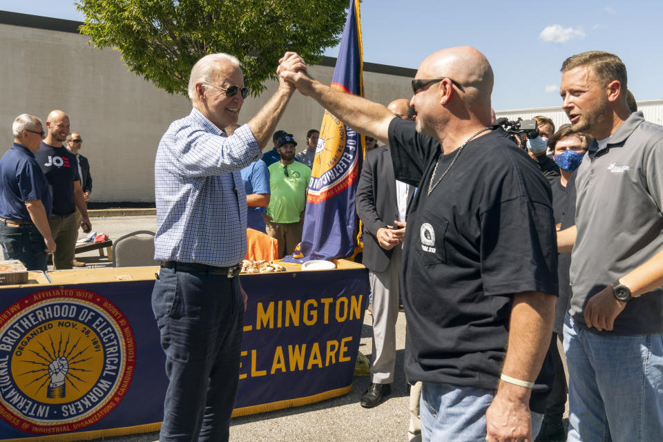 President Joe Biden greets labor union members of the International Brotherhood of Electrical Workers (IBEW) Local 313 in New Castle, Del., commemorating Labor Day, Monday, Sept. 6, 2021. (AP Photo/Manuel Balce Ceneta)