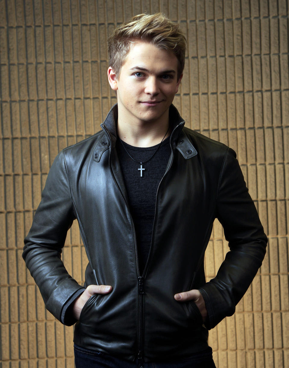 FILE - This March 8, 2012 file photo shows Hunter Hayes in Nashville, Tenn. The 21-year-old Louisiana native is up for three trophies at the Feb. 10 Grammy Awards in Los Angeles, including all-genre award best new artist. The nominations punctuate a period of great growth for Hayes in the 18 months since he released that album. He scored his first No. 1 with "Wanted," becoming the youngest solo male country performer to top the chart. And he began to play in front of larger crowds on tour with several established stars, including Carrie Underwood. (AP Photo/Mark Humphrey, file)