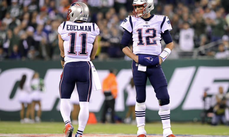 Tom Brady talks to Julian Edelman.