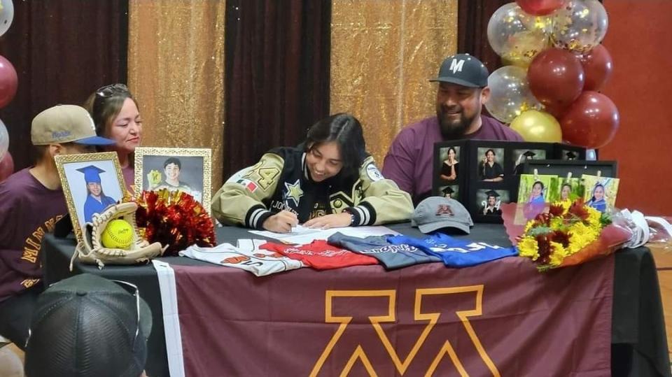 Millennium's Jocelyn Hernandez signs her letter of intent to play softball at University of Minnesota Crookston on National Signing Day at Millennium High School on Nov. 8, 2023.