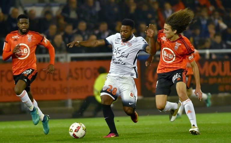 Montpellier's French midfielder Stephane Sessegnon (C) vies with Lorient's midfielder Matteo Guendouzi Olie (R) during the French L1 football match Lorient vs Montpellier, at the Moustoir stadium in Lorient, western France, on October 29, 2016