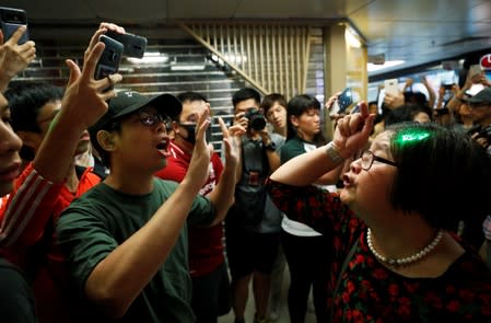 Pro-China demonstrators and anti-government protesters argue at Amoy Plaza shopping mall in Kowloon Bay, Hong Kong