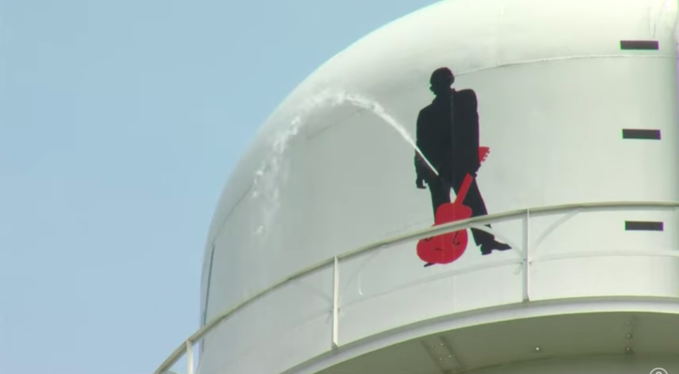 A Johnny Cash mural on a water tower was vandalised in the rock star’s hometown of Kingsland, Arkansas (WKYC Channel 3/Youtube)