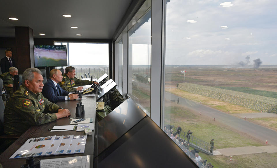 Russian President Vladimir Putin, center, Russian Defense Minister Sergei Shoigu, left, and Russian General Staff Valery Gerasimov, right, watch the joint strategic exercise of the armed forces of the Russian Federation and the Republic of Belarus Zapad-2021 at the Mulino training ground in the Nizhny Novgorod region, Russia, Monday, Sept. 13, 2021. The military drills attend by servicemen of military units and divisions of the Western Military District, representatives of the leadership headquarters and personnel of military contingents of the armed forces of Armenia, Belarus, India, Kazakhstan, Kyrgyzstan and Mongolia. (Alexei Druzhinin, Sputnik, Kremlin Pool Photo via AP)