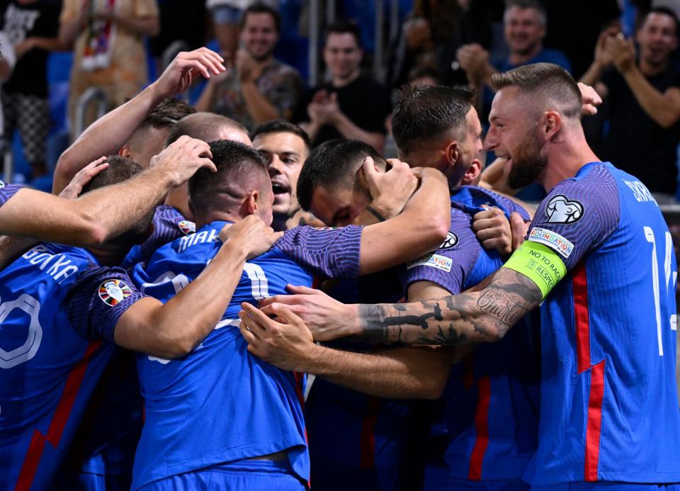 <span>Slovakia’s players engulf David Hancko after his first-minute opener against Liechtenstein last September, in which all three of their goals came before the seventh minute.</span><span>Photograph: Radovan Stoklasa/Reuters</span>