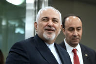 FILE - In this Sept. 23, 2019, file photo, Iranian Foreign Minister Mohammad Javad Zarif, left, arrives for the 74th session of the United Nations General Assembly, at U.N. headquarters. Iran on Saturday criticized the United States for what it called an “inhumane” decision to bar its foreign minister who was attending the U.N. summit meetings in New York from visiting a hospitalized Iranian diplomat in the city. (AP Photo/Craig Ruttle, File)