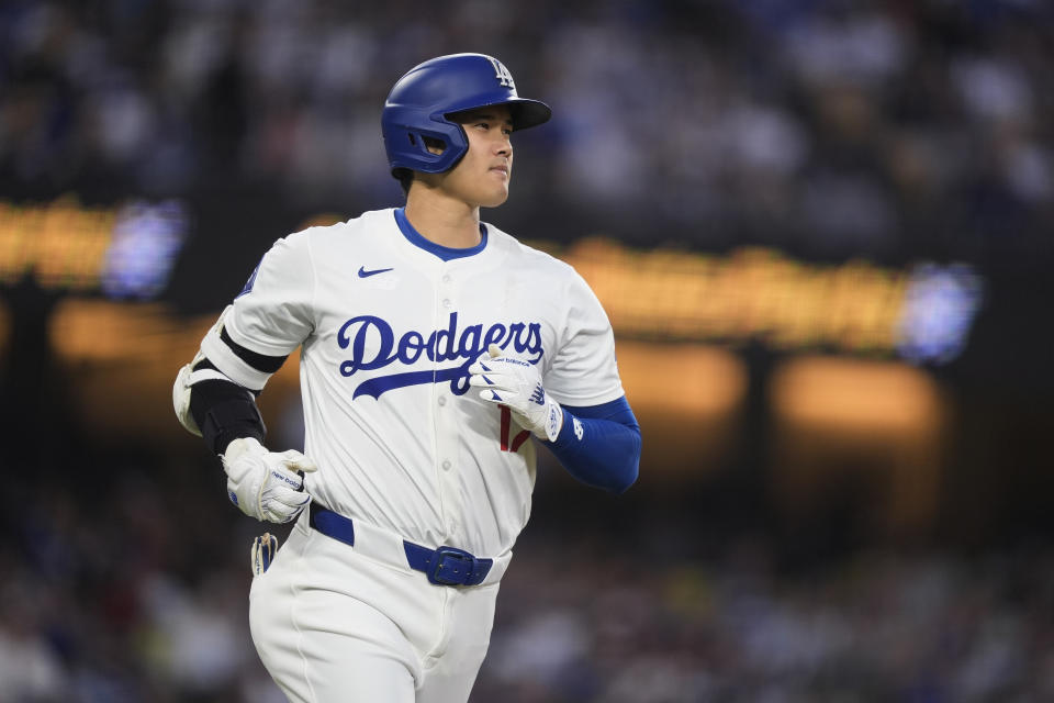 Los Angeles Dodgers designated hitter Shohei Ohtani watches his line out to Texas Rangers left fielder Wyatt Langford during the third inning of a baseball game Thursday, June 13, 2024, in Los Angeles. (AP Photo/Ryan Sun)