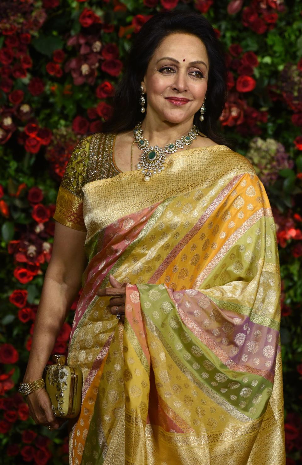 Indian Bollywood actress Hema Malini poses for a picture during the wedding reception party of actors Ranveer Singh and Deepika Padukone in Mumbai late on December 1, 2018. (Photo by Sujit Jaiswal / AFP) (Photo by SUJIT JAISWAL/AFP via Getty Images)