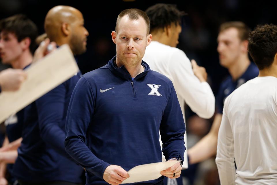 Xavier Musketeers head coach Travis Steele walks into a huddle in the first half of the NIT First Round game between the Xavier Musketeers and the Cleveland State Vikings at the Cintas Center in Cincinnati on Tuesday, March 15, 2022.