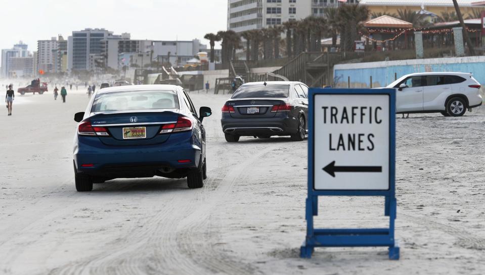 Cars roll south on the beach at the International Speedway Boulevard beach ramp, Tuesday, Jan. 24, 2023, as their drivers look for the best parking spot.