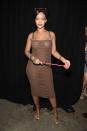 <p>In a brown ruched tube dress and matching headscarf while backstage at the Savage x Fenty lingerie runway during New York Fashion Week.<br></p>