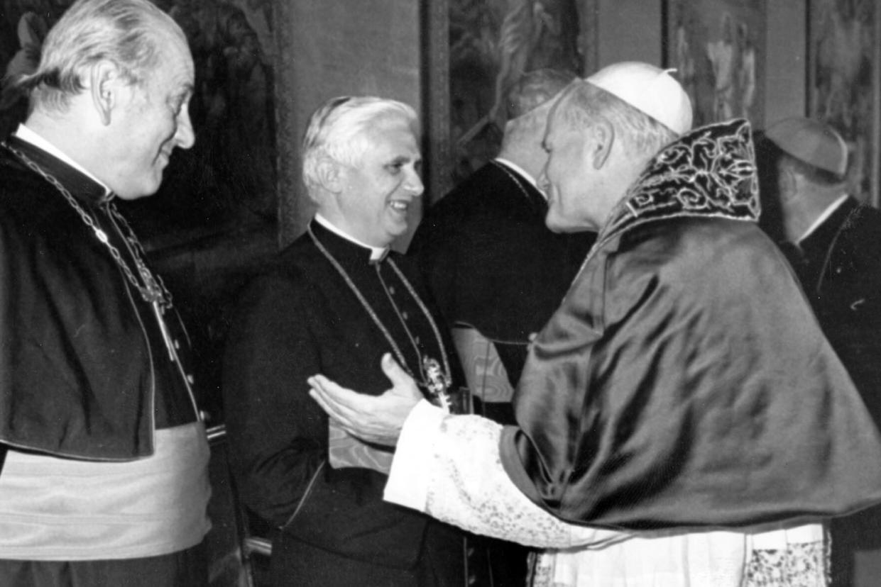 FILE - Pope John Paul II, right, speaks to German cardinals Alfred Bengsch and Joseph Ratzinger, center, in the consistory hall of the Vatican Apostolic Palace, where the new elected Pontiff receives cardinals, on Oct. 18, 1979. Cardinal Ratzinger went on to become Pope Benedict XVI. Pope Emeritus Benedict XVI, the German theologian who will be remembered as the first pope in 600 years to resign, has died, the Vatican announced Saturday. He was 95. (AP Photo/Pool, File)