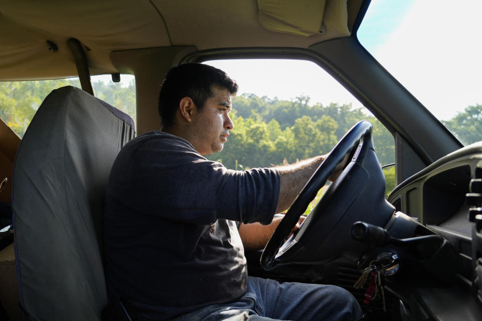 Pedro Murrieta Baltazar drives a van to another part of a field to harvest vegetables, Friday, July 7, 2023, at a farm in Waverly, Ohio. As Earth this week set and then repeatedly broke unofficial records for average global heat, it served as a reminder of a danger that climate change is making steadily worse for farmworkers and others who labor outside. (AP Photo/Joshua A. Bickel)