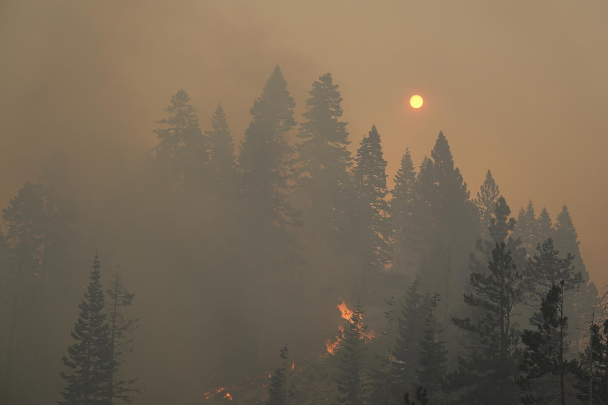 The sun is visible through thick smoke as the Caldor Fire continues to burn in South Lake Tahoe, Calif., Tuesday, Aug. 31, 2021. (AP Photo/Jae C. Hong)