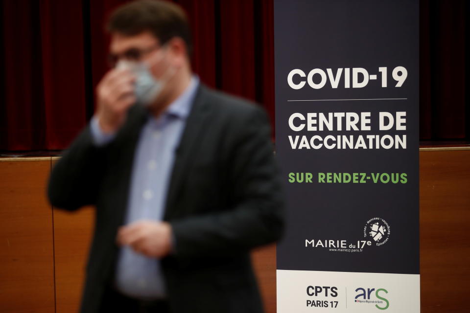 Paris 17th district mayor Geoffroy Boulard talks to journalists near empty vaccination booths, at a coronavirus disease vaccination center in the city hall of the 17th district in Paris, which was not allowed to open because of a COVID-19 vaccines shortage in France, January 29, 2021.  REUTERS/Benoit Tessier