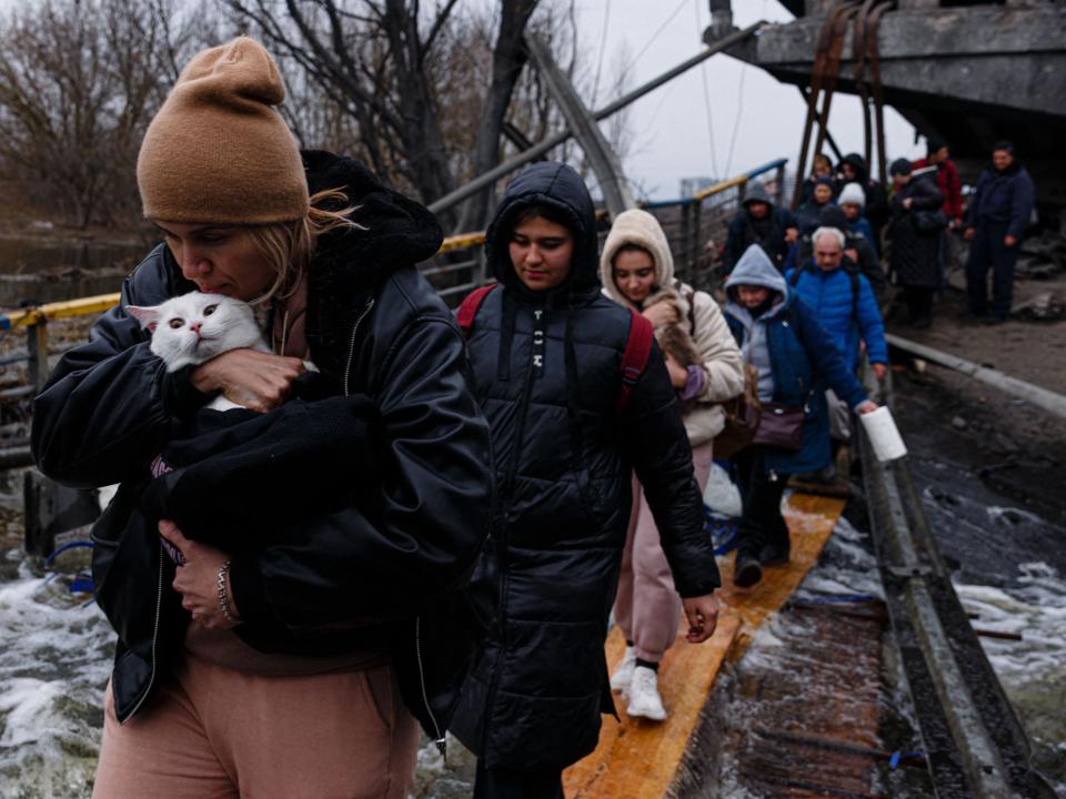 Evacuees fleeing Irpin, northwest of Kyiv, via a humanitarian corridor (Dimitar Dilkoff/AFP via Getty Images)