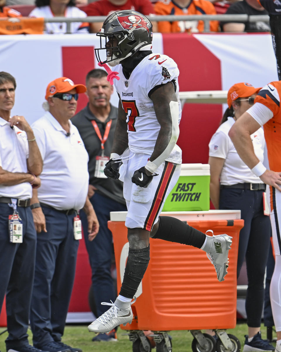 Tampa Bay Buccaneers running back Bucky Irving celebrates a long run against the Denver Broncos during the first half of an NFL football game, in Tampa, Fla. on Sunday, Sept. 22, 2024. (AP Photo/Jason Behnken)