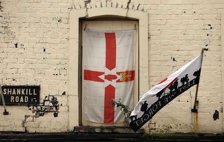 The Ulster Banner hangs at a window on Shankill road in West Belfast August 18, 2014. REUTERS/Cathal McNaughton