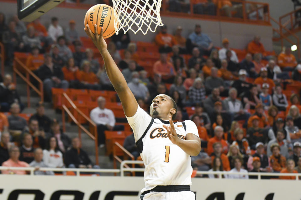 Oklahoma State guard Bryce Thompson (1) drives to the basket during the first half of an NCAA college basketball game against Texas, Saturday, Jan. 7, 2023, in Stillwater, Okla. Texas defeated Oklahoma State 56-46. (AP Photo/Brody Schmidt)