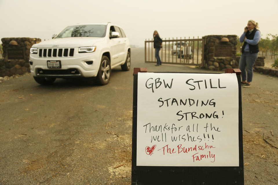 <p>A sign tells people that the historic Gundlach Bundschu Winery is still standing, Tuesday, Oct. 10, 2017, in this view near Sonoma, Calif. Workers in Northern California’s renowned wine country picked through charred debris and weighed what to do with pricey grapes after wildfires swept through lush vineyards and destroyed at least two wineries and damaged many others. (Photo: Eric Risberg/AP) </p>