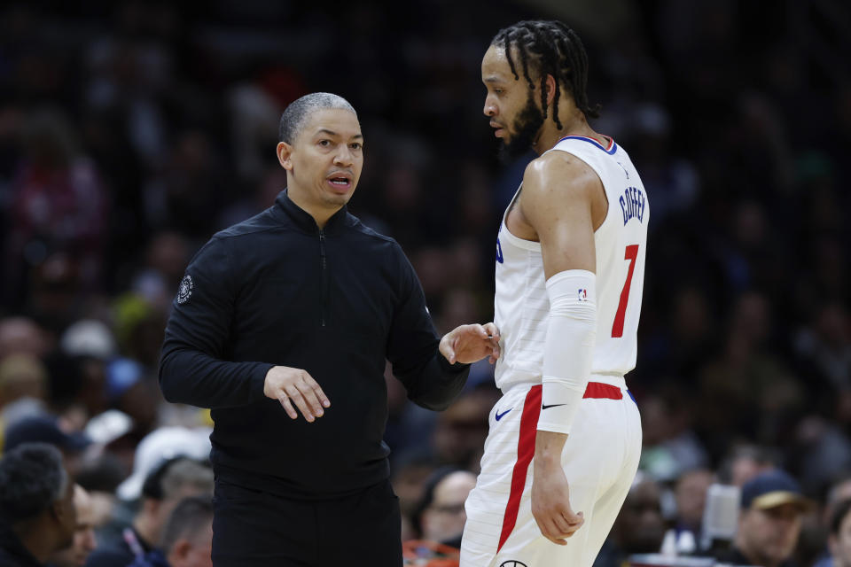 Los Angeles Clippers head coach Tyronn Lue, left, talks with guard Amir Coffey, right, during the second half of an NBA basketball game against the Cleveland Cavaliers, Monday, Jan. 29, 2024, in Cleveland. (AP Photo/Ron Schwane)