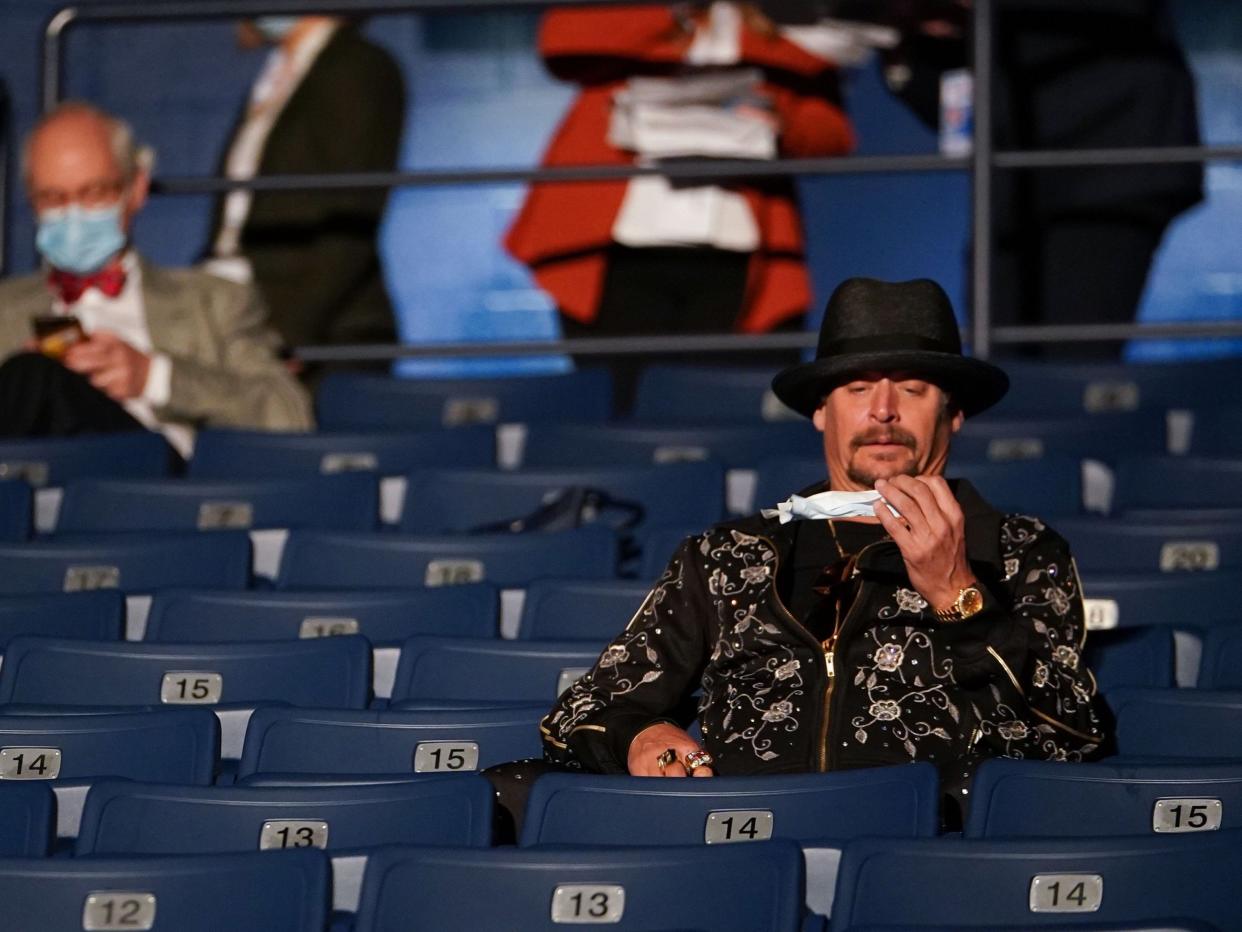 Kid Rock appeared confused by his face mask (AFP via Getty Images)