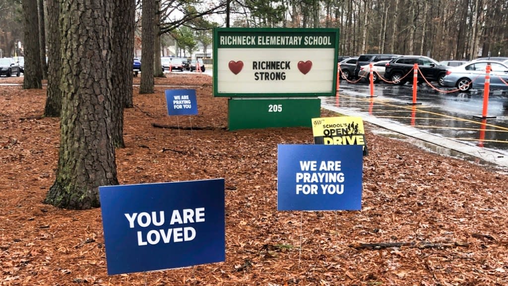 Signs stand outside Richneck Elementary School in Newport News, Virginia on Jan. 25. The mother a six-year-old who shot his teacher in Virginia is expected to plead guilty Tuesday, seven months after her son used her handgun in the classroom shooting. (Photo: Denise Lavoie/AP, File)