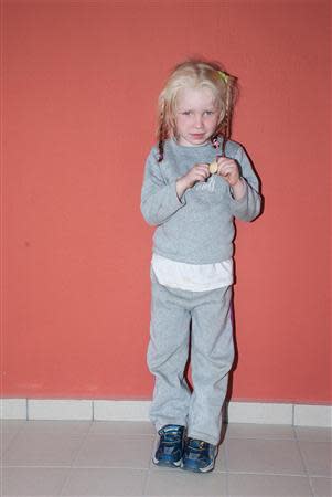 A four-year-old girl, found living with a Roma couple in central Greece, is seen in a handout photo distributed by the Greek police and obtained by Reuters October 18, 2013. REUTERS/Greek Police/Handout