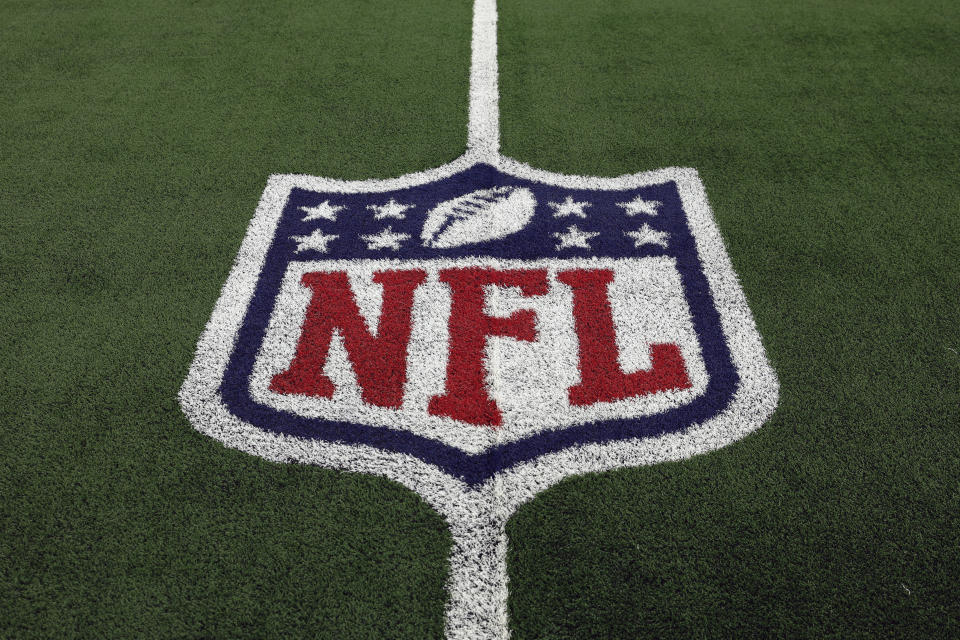 FILE - The NFL logo is shown on the field before an NFL football game between the Detroit Lions and the Dallas Cowboys, Saturday, Dec. 30, 2023, in Arlington, Texas. The NFL’s salary cap for 2024 will be $255.4 million, up a record $30.6 million from last year.(AP Photo/Matt Patterson, File)