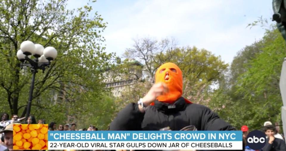 Hundreds of people gathered in Union Square Park in Manhattan on Saturday to watch a man eat cheeseballs. ABC News