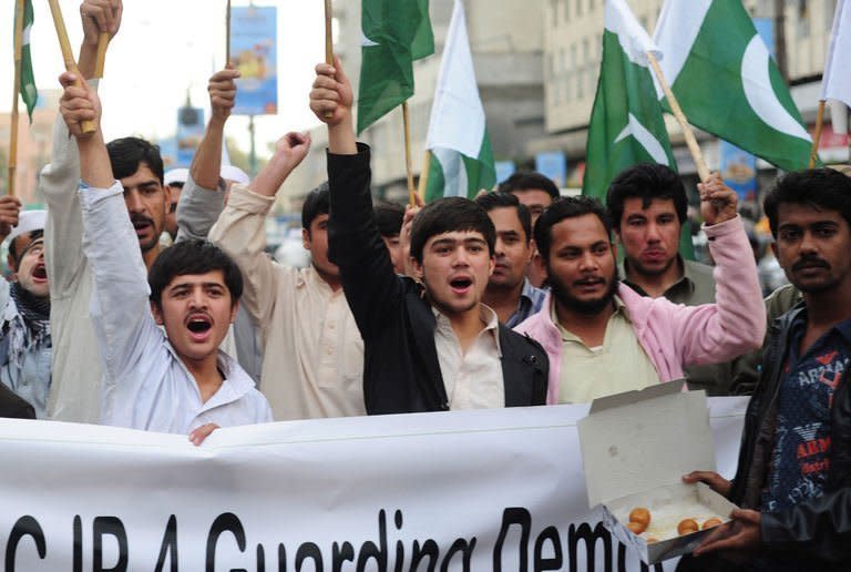 Pasban Pakistan supporters chant slogans in Karachi on January 15, 2013, as they support of a Supreme Court decision to arrest the prime minister over corruption allegations