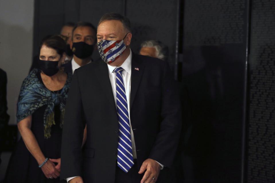 U.S. Secretary of State Mike Pompeo and his wife Susan visit the Jewish Museum in the northern city of Thessaloniki, Greece, Monday, Sept. 28, 2020. Pompeo said Monday the United States will use its diplomatic and military influence in the region to try to ease a volatile dispute between NATO allies Greece and Turkey over energy rights in the eastern Mediterranean. (AP Photo/Giannis Papanikos, Pool)