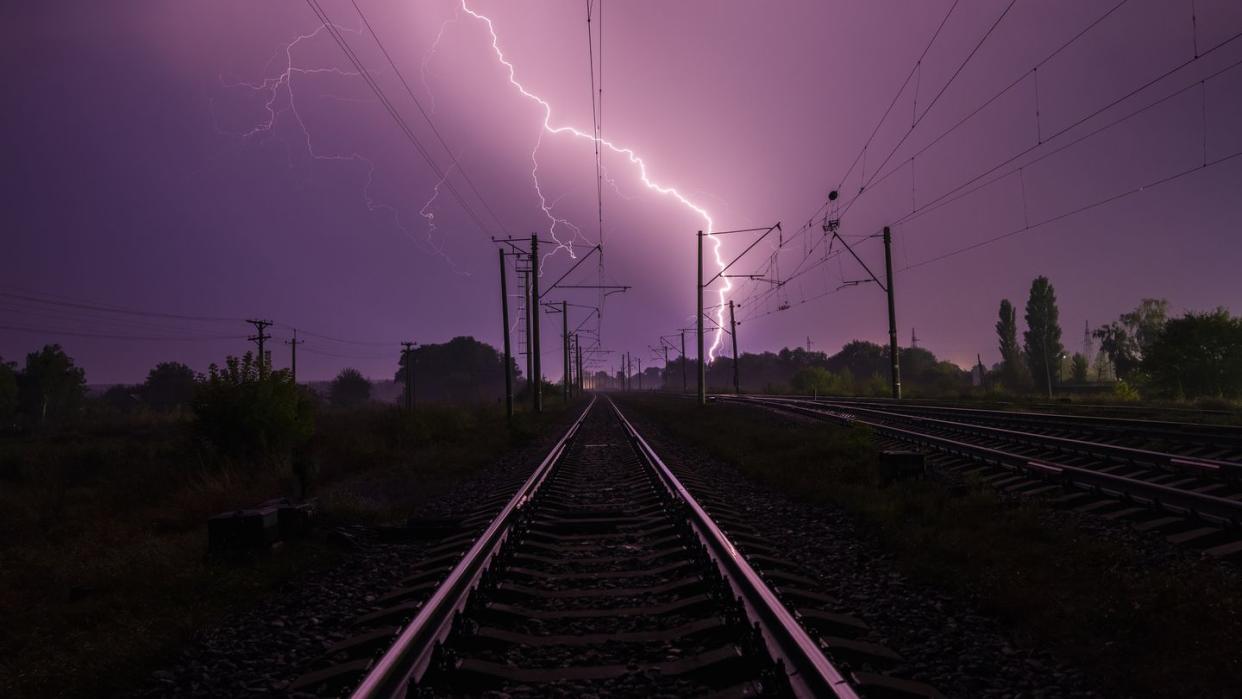 lightning over the railroad at night