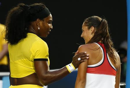 Serena Williams of the U.S. (L) consoles Russia's Daria Kasatkina after Williams won their third round match at the Australian Open tennis tournament at Melbourne Park, Australia, January 22, 2016. REUTERS/Thomas Peter