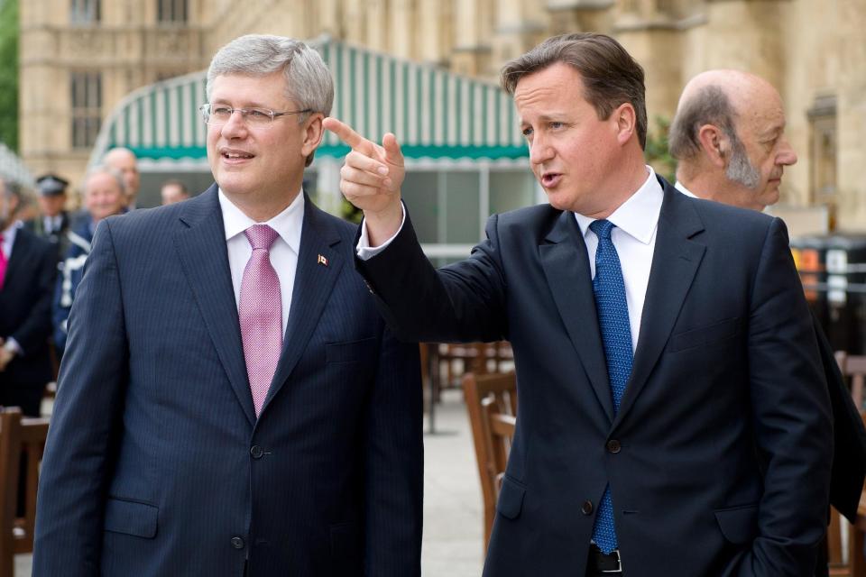 Prime Minister David Cameron talks with his Canadian counterpart Stephen Harper ahead of Mr Harper's address to the House of Commons in central London.