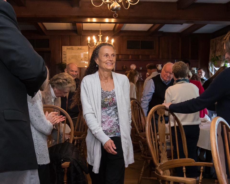 Lisa Parker gets a standing ovation as she is announced as the Distinguished Citizen of the Year in Hampton during a ceremony at the Old Salt Restaurant Tuesday, May 10, 2022.