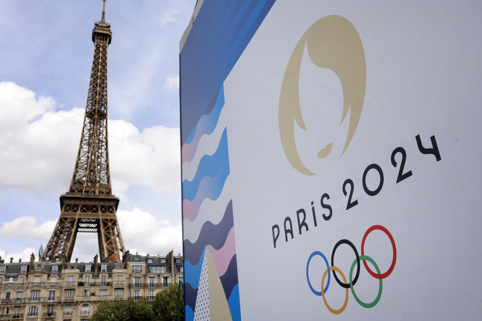 PARIS, FRANCE - JUNE 17: The Paris 2024 logo is displayed near the Eiffel Tower before the start of the Paris 2024 Olympic and Paralympic Games on June 17, 2024 in Paris, France. The city is gearing up to host the XXXIII Olympic Summer Games, from 26 July to 11 August. (Photo by Chesnot/Getty Images)