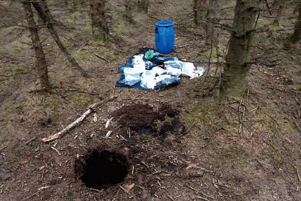 Explosive stash: a barrel containing weapons, which were recovered from a 'terrorist hide' in woodland at Capanagh Forest (PA)