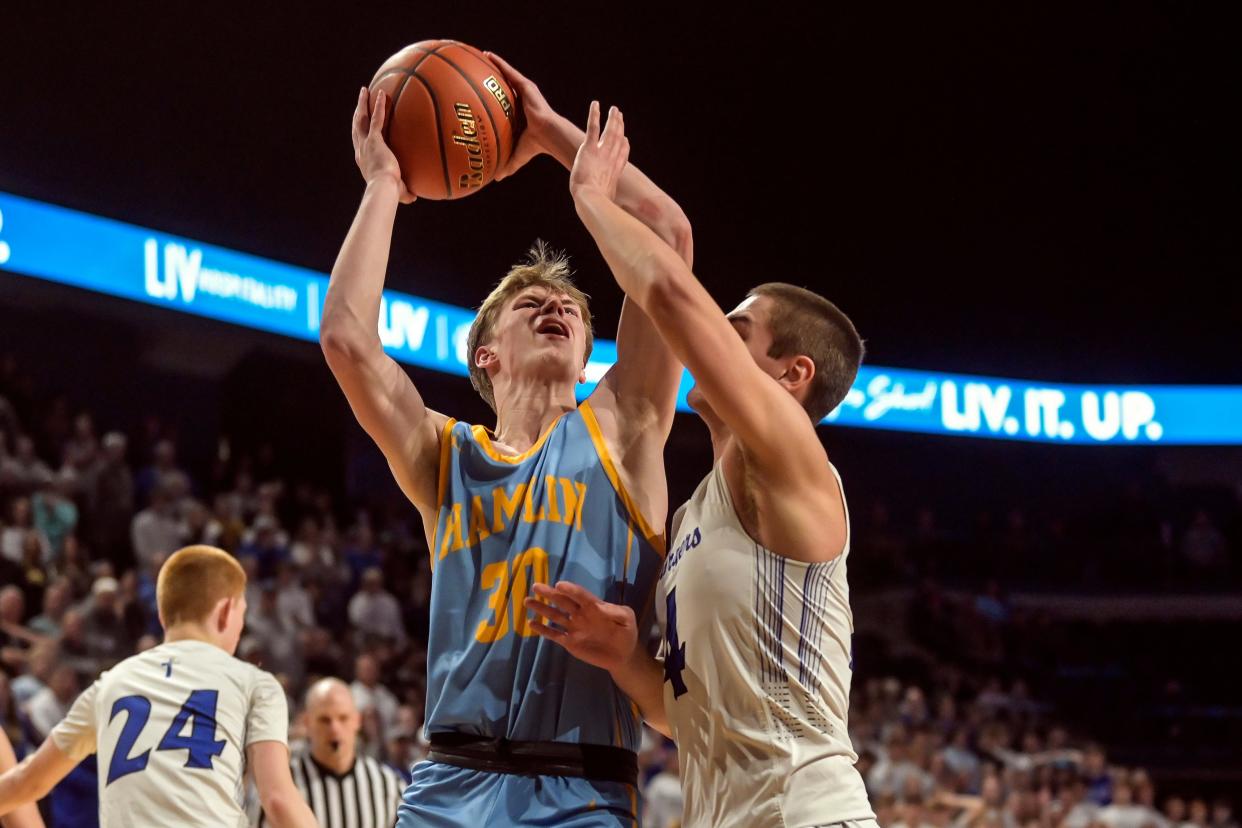 Hamlin's Tyson Stevenson (30) goes to the basket as Sioux Falls Christian's Jude vanDonkersgoed (4) during the championship game of the state Class A boys basketball tournament on Saturday, March 16, 2024 in the Summit Arena at The Monument in Rapid City.