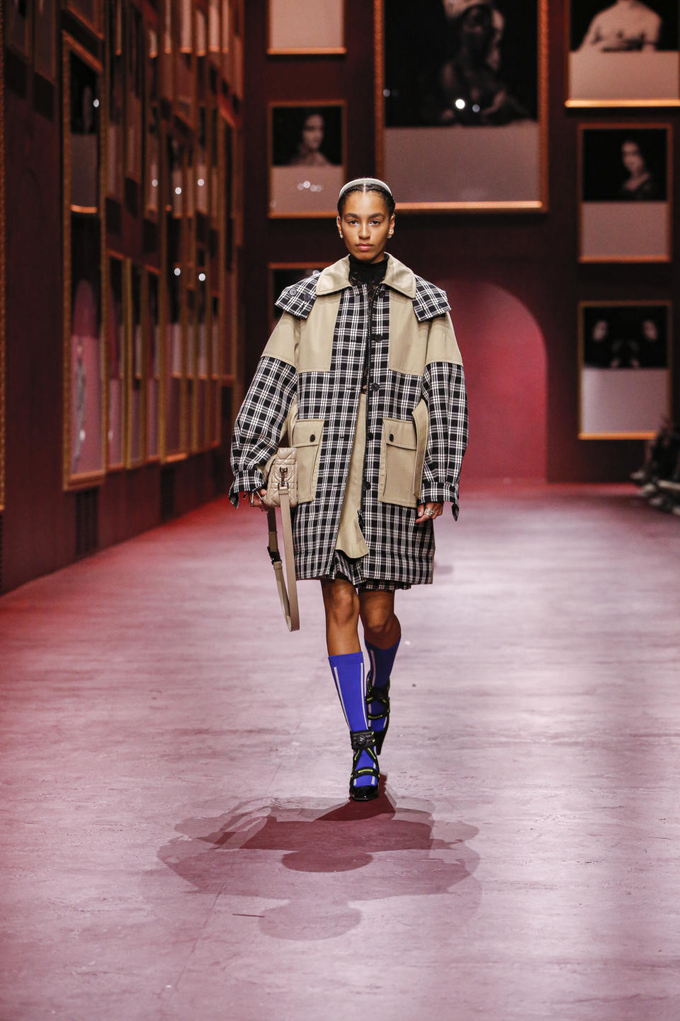 A checked coat with blue knee socks and Mary Jane pumps from Christian Dior fall ’22. - Credit: Frederique DUMOULIN