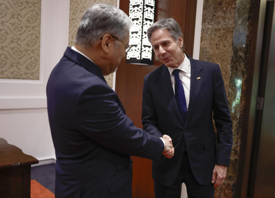 U.S. Secretary of State Antony Blinken, right, shakes hands with Philippines' Secretary of Foreign Affairs Enrique Manalo at the Sofitel Hotel in Manila, Philippines Tuesday, March 19, 2024. (Evelyn Hockstein/Pool Photo via AP)