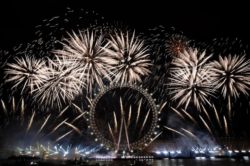 Fireworks light-up the sky over the London Eye in central London to celebrate the New Year on Monday, Jan. 1, 2024.(AP Photo/Alberto Pezzali)