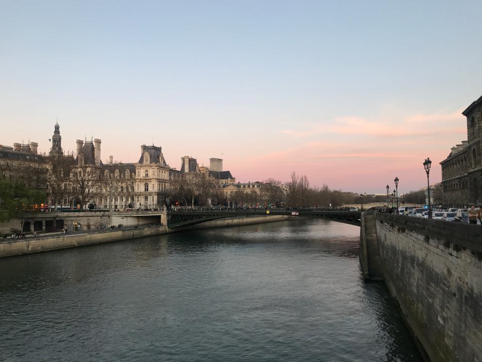view of the seine at sunset from the banks in paris