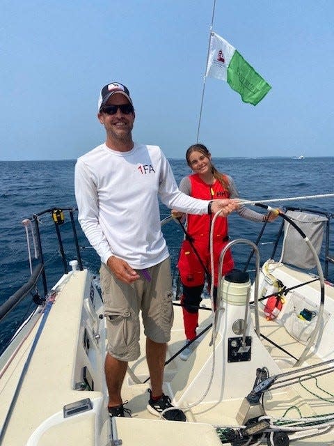 Merritt Sellers, 15, of Larkspur, Calif., drives the J/111 nosurprise toward the finish line of the Chicago to Mackinac race on Monday, July 24, 2023. Her father, Scott Sellers, is adjusting the sail lines. The boat won its highly competitive class for the third year in a row. He is the son of Bob Sellers, an accomplished sailor who owned the Pontiac Buick General Motors dealership in Farmington Hills.