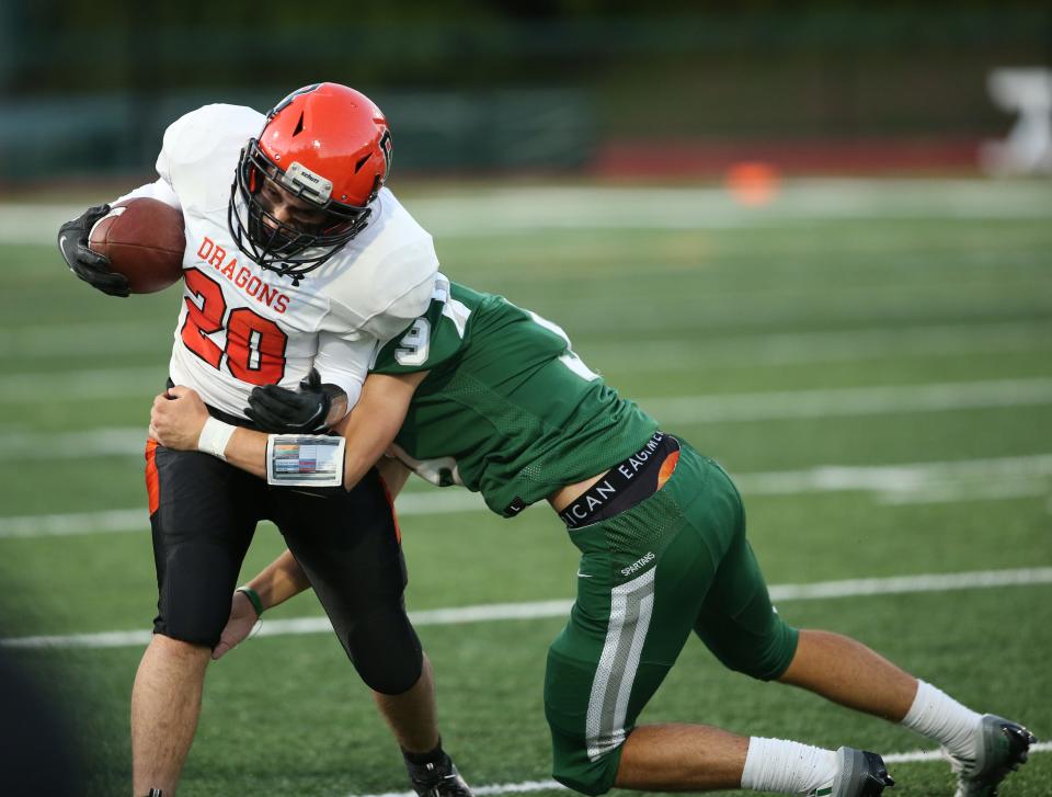 Spackenkill's Carter Usher tackles Dover's Jayson Vitolo during Friday's game in the Town of Poughkeepsie on September 23, 2022. 