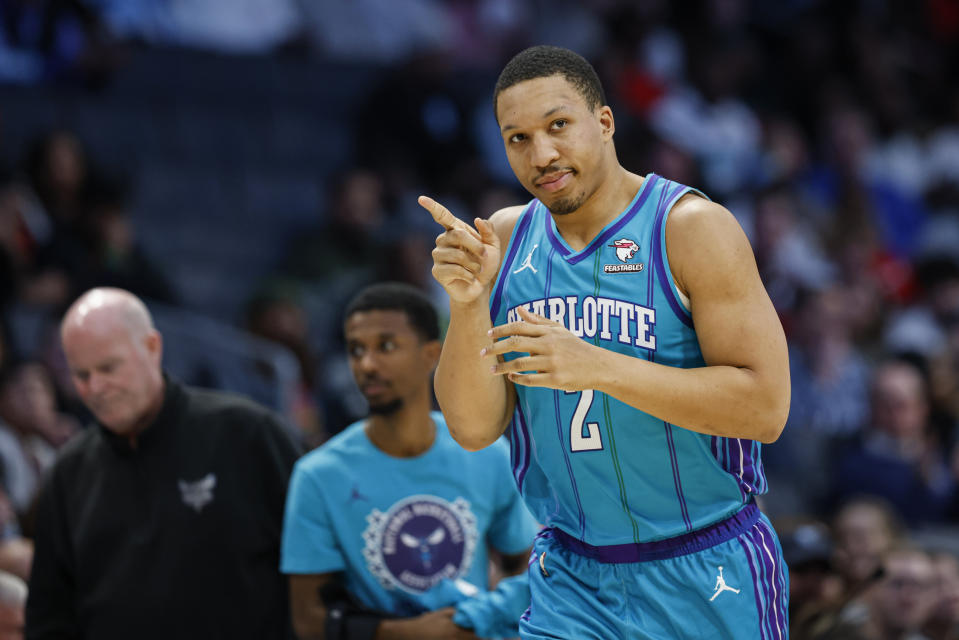 Charlotte Hornets forward Grant Williams (2) reacts after scoring against the Memphis Grizzlies during the first half of an NBA basketball game in Charlotte, N.C., Saturday, Feb. 10, 2024. (AP Photo/Nell Redmond)